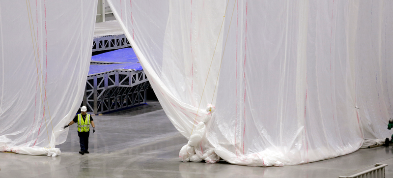 Huge curtains are used to stop dust from moving between sections of the facility.